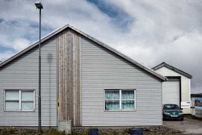 House and Green Car. Hölmavik